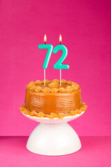 Birthday card with candle number 72 - Cake with dulce de leche frosting.