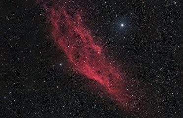Real photograph of the California Nebula NGC 1499, a striking emission nebula in the Perseus constellation, glowing with hydrogen gas. High quality photo