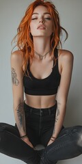 Confident young woman with red hair in edgy black outfit and denim © artisticALLY