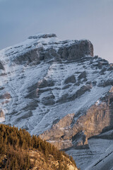 Sunrise on a mountain with fog in winter. Alberta, Canada