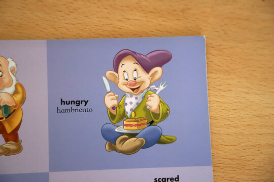 
Children's book for teaching English and Spanish with an illustration of the dwarf Dopey from the Disney movie Snow White