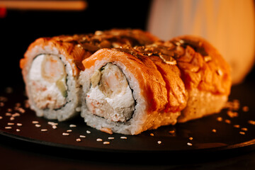 Freshly Prepared Sushi Set Beautifully Displayed Against a Dark Background With Elegant Presentation and Meticulous Garnishing