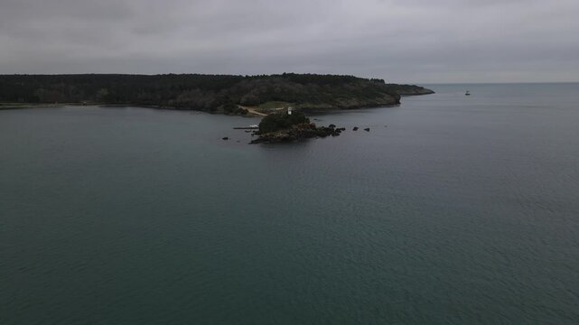 White Lighthouse In Coastline