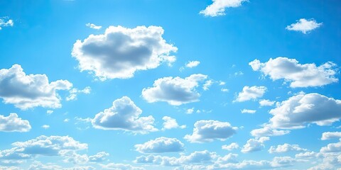 Morning backdrop featuring a vibrant blue sky adorned with soft white clouds, creating a serene atmosphere perfect for showcasing the beauty of a bright morning background.