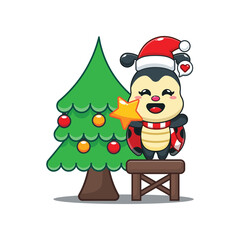 Cute ladybug decorating the Christmas tree on Christmas day.