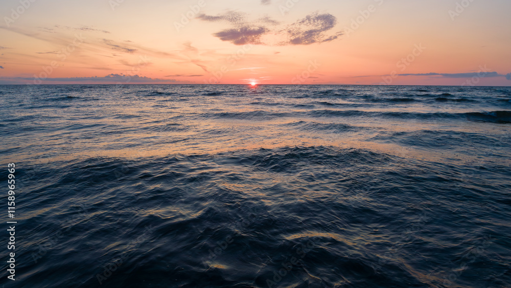 Poster the sunrise sun is setting over the ocean as a beautiful backdrop for a web page banner template. th