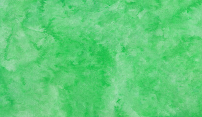 Beautiful watercolor green background with green brush strokes on textured handmade paper for template, page or banner
