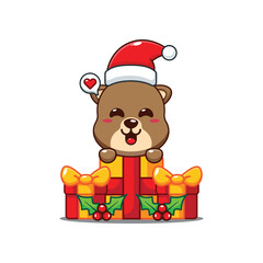 Cute otter is happy to receive a Christmas gift cartoon vector illustration.