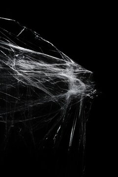 Black Background Wallpaper with the Texture of Wrinkled Plastic Wrap