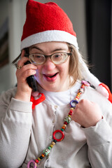 Indoor portrait 42 yo Down Syndrome woman calling her family in Brussels, Belgium
