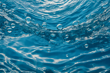 clear blue water with bubbles background. Refreshing aquatic design with soft ripples and air bubbles