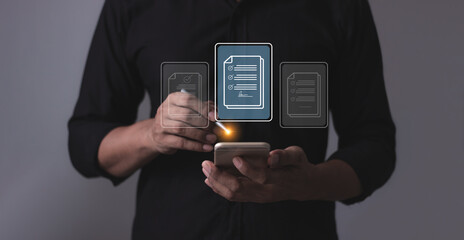 Young man with smartphone mobile hand using a pen touching to sign a Online Business Contract, Electronic signature, Contract signing, Digital documents, Future smart contract