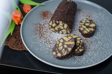 No bake chocolate salami - dessert of cookies, chocolate, butter and condensed milk