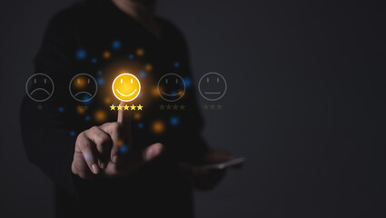 Happy Customer, Young Man using smartphone mobile hand touching emoji five star to review and give 5 stars with very good results in service, Good review 5 star rating choice feedback