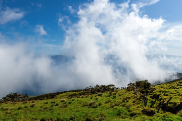 Aerial view of the clouds over Pico island Azores Portugal green mountains and meadows