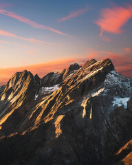 Alpi Apuane snowy mountains at sunset in winter. Carrara, Tuscany, Italy.