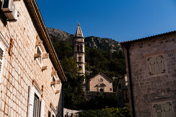 Fototapeta premium bell tower of St Nikolas Church, amazing medieval stone architecture with archs, historical heritage