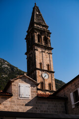 Fototapeta premium bell tower of St Nikolas Church, amazing medieval stone architecture with archs, historical heritage