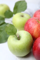 Many fresh ripe apples on table, closeup