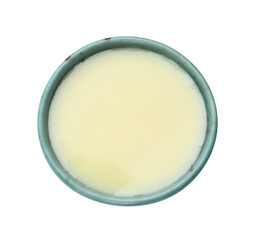Condensed milk in bowl isolated on white, top view