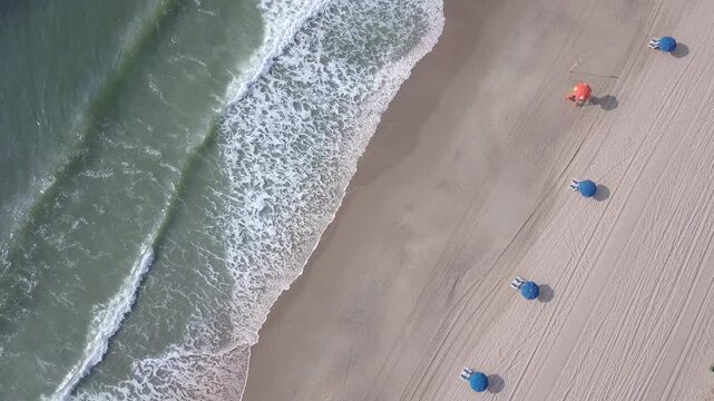 Aerial straight down view of waves crashing along the Atlantic coast at Myrtle Beach, South Carolina, USA.