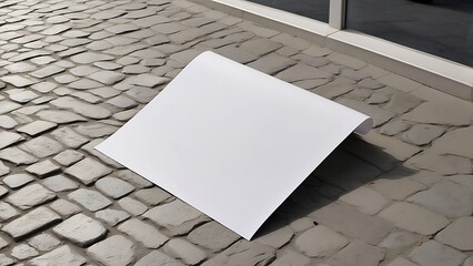 On a pavement wall is a mockup white paper or white sticker poster. Details with a clipping route and promotion information for marketing announcements