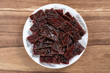 top view beef jerky on wood background