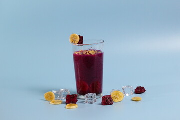 banana and red dragon fruit healthy fresh smoothie in glasses isolated on bright background. healthy diet photo concept.