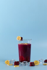 banana and red dragon fruit healthy fresh smoothie in glasses isolated on bright background. healthy diet photo concept.