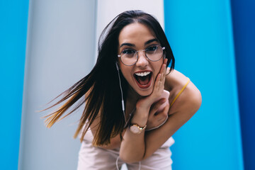 Happy woman making grimace of astonishment