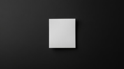 A solitary sticky note on smooth paper surface surrounded by negative space minimalistic aesthetic emphasizing clarity and intention sleek and modern