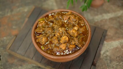 Indian Chicken Curry served on a table, featuring spicy chicken in rich gravy. A vibrant Indian dish ideal for restaurant menus, food displays, street food promotions, and commercial projects.