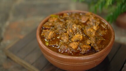 Indian Chicken Curry served on a table, featuring spicy chicken in rich gravy. A vibrant Indian dish ideal for restaurant menus, food displays, street food promotions, and commercial projects.