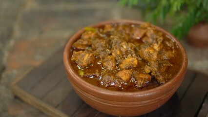 Indian Chicken Curry served on a table, featuring spicy chicken in rich gravy. A vibrant Indian dish ideal for restaurant menus, food displays, street food promotions, and commercial projects.