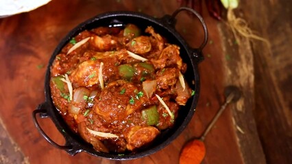 Indian Chicken Curry served on a table, featuring spicy chicken in rich gravy. A vibrant Indian dish ideal for restaurant menus, food displays, street food promotions, and commercial projects.