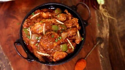 Indian Chicken Curry served on a table, featuring spicy chicken in rich gravy. A vibrant Indian dish ideal for restaurant menus, food displays, street food promotions, and commercial projects.