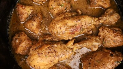 Indian Chicken Curry served on a table, featuring spicy chicken in rich gravy. A vibrant Indian dish ideal for restaurant menus, food displays, street food promotions, and commercial projects.