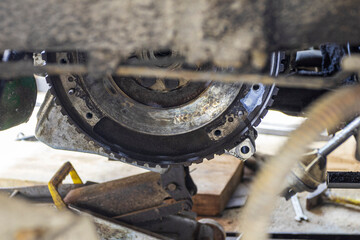 flywheel. in disassembled state also there are traces of use. close-up. warning part.