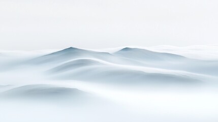 Obraz premium Misty, ethereal mountainscape; soft, blurred peaks emerging from a sea of fog.