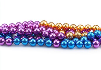Vibrant Colorful Beads in Purple, Blue, and Gold Arranged Neatly on a White Background for Celebration or Crafting Purposes