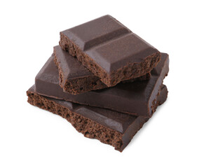 Pieces of delicious dark chocolate isolated on white