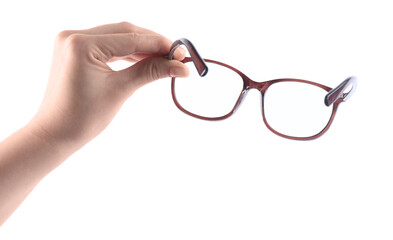 Woman holding glasses with brown frame on white background, closeup