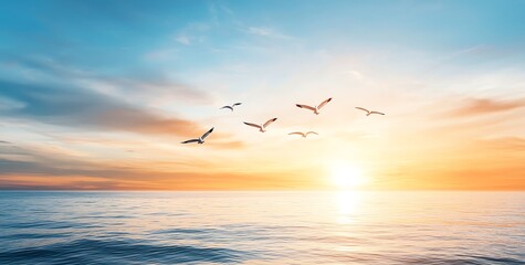 A stunning seascape at sunset with vibrant colors. Birds gracefully fly across the sky as the sun sets over the tranquil ocean, creating a peaceful and serene atmosphere.
