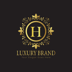 Letter H Luxury brand logo design with a royal gold crown emblem and elegant typography
