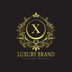 Letter X Luxury brand logo design with a royal gold crown emblem and elegant typography
