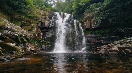 Obraz premium A majestic large waterfall, creating a powerful and awe-inspiring scene,
