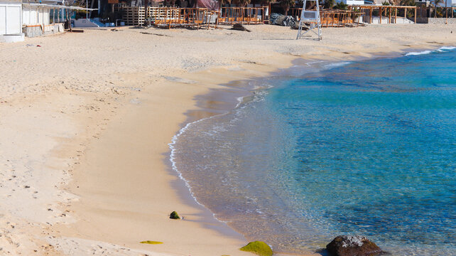 Calm shoreline with clear water and soft sand, capturing a peaceful coastal atmosphere ideal for travel, relaxation, tourism and tropical beach experiences