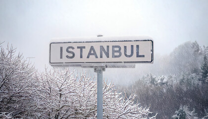 sign saying -Istanbul- under the snow. heavy snowfall in Istanbul, blurred taksim square