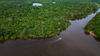 AERIAL PHOTOS OF THE NANAY RIVER AND BOATS NAVIGATING IN ITS WATERS, IN THE PERUVIAN AMAZON JUNGLE,...