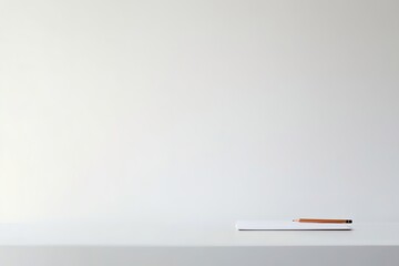 study guide and pencil placed on minimalist desk with white background